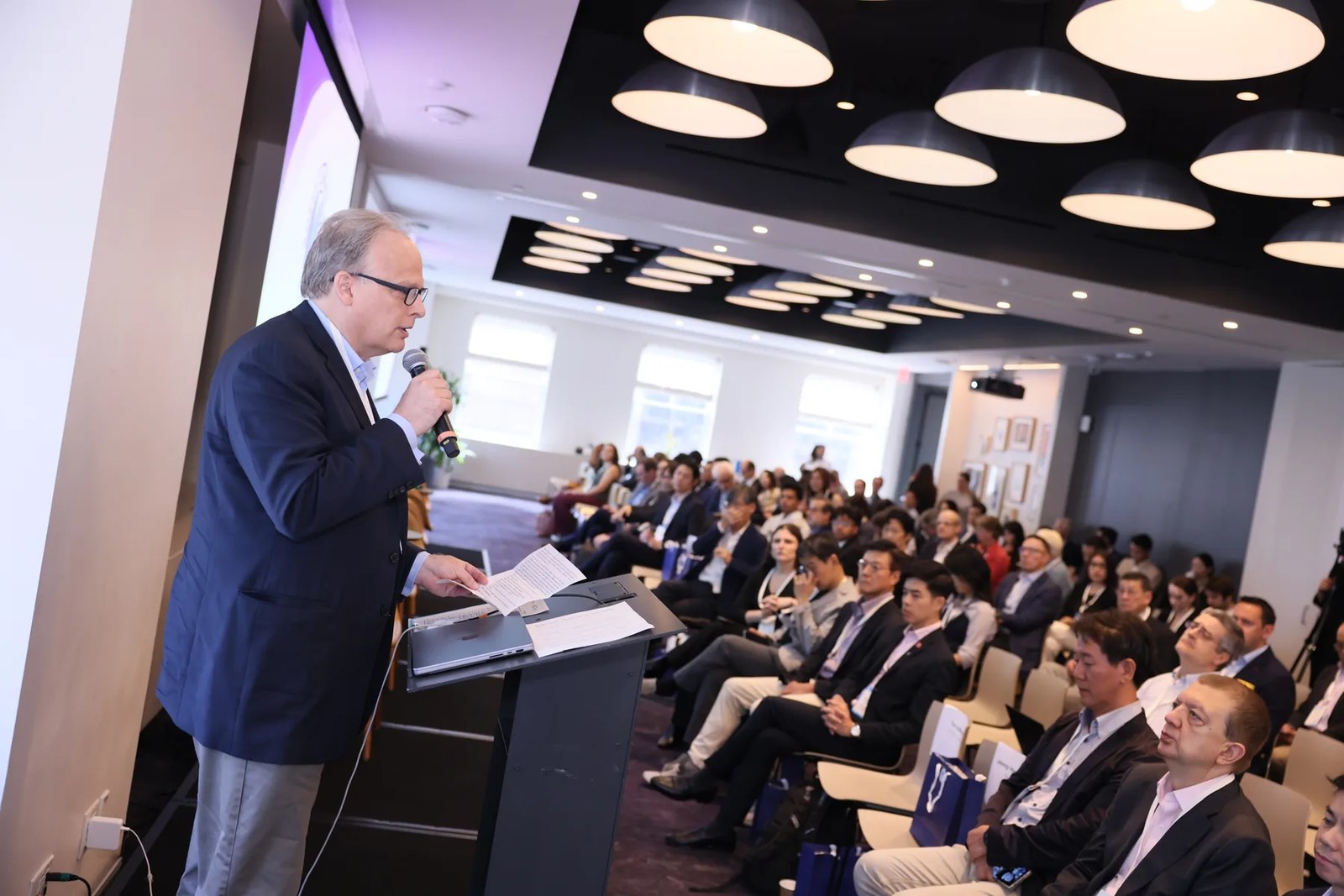 A speaker addressing the audience at the 2025 Korea Climate Tech Summit