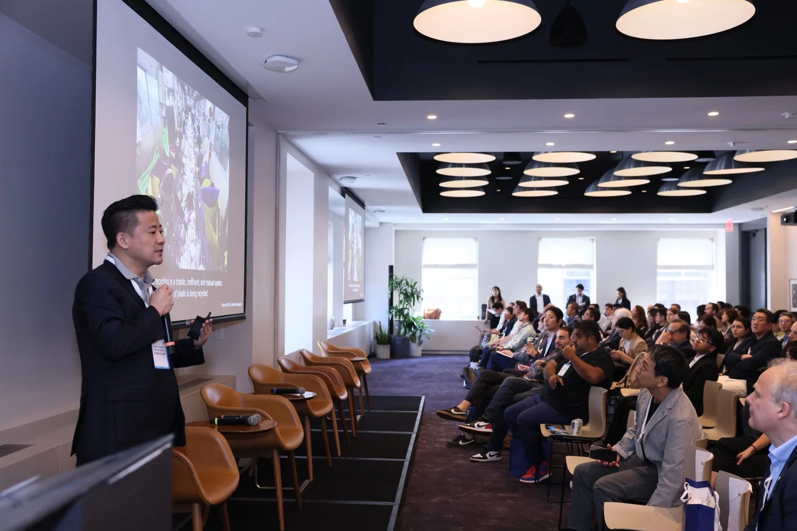 A startup founder presenting to the audience at the 2025 Korea Climate Tech Summit